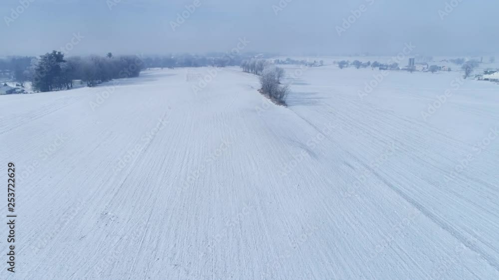 Aerial View of Early Morning Sunrise After a Snow Fall in Amish Countryside as Senn by s Drone Aerial View of Early Morning Sunrise After a Snow Fall in Amish Countryside as Senn by s Drone