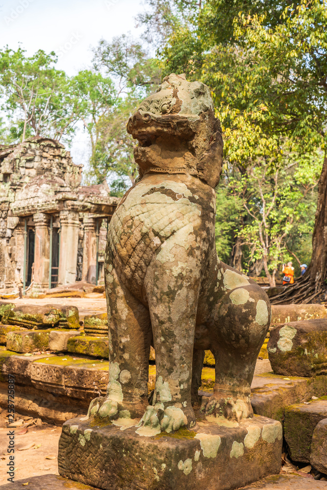 Khmer style Leo sculpture at the entrance to Ta Prohm temple, Cambodia