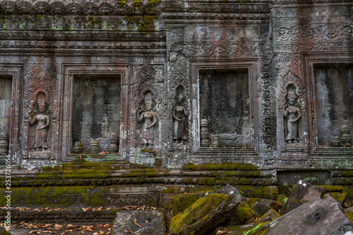 Wallpaper Mural Relief of apsaras and false windows with balusters in Ta Prohm temple, Cambodia Torontodigital.ca