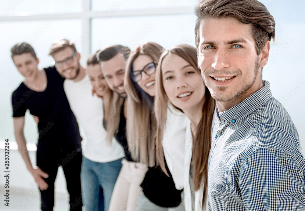 group of successful young people standing in the office group of successful young people standing in the office