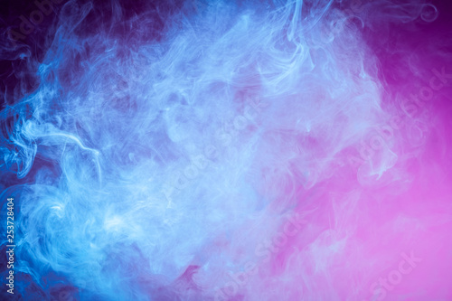 Blue cloud of smoke of pink isolated background. Background from the smoke of vape.