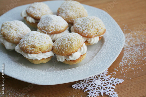 Wallpaper Mural Traditional cinnammon whoopie pies filled with vanilla cream on a plate on wooden table Torontodigital.ca