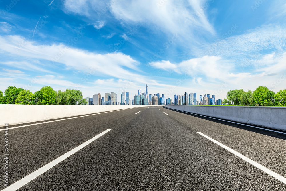 Fototapeta premium Empty asphalt road and panoramic city skyline with buildings in Shanghai
