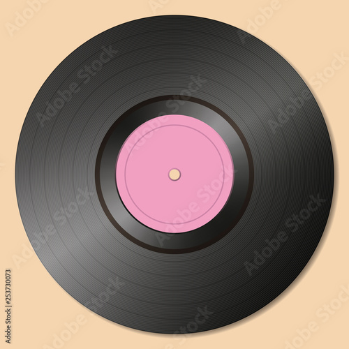 Old-fashioned vinyl record on a gray background.