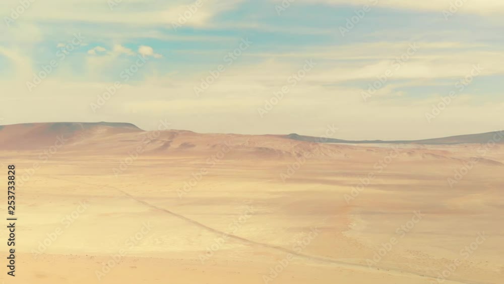 Aerial panoramic view of a road crossing the Paracas desert at Paracas national parc, Peru. Aerial panoramic view of a road crossing the Paracas desert at Paracas national parc, Peru.