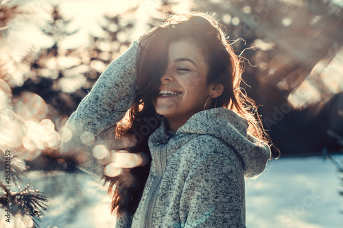 Woman enjoys a winter sunny day 