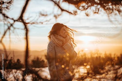 Woman enjoys a winter sunny day 