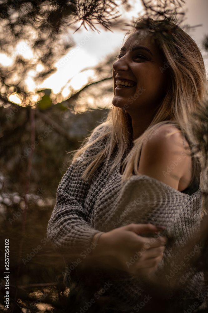 Portrait of a woman during sunset next to a lake, Black Forest, Germany Portrait of a woman during sunset next to a lake, Black Forest, Germany