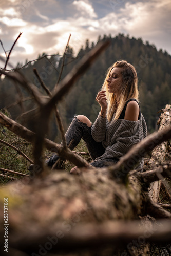 Portrait of a woman during sunset next to a lake, Black Forest, Germany