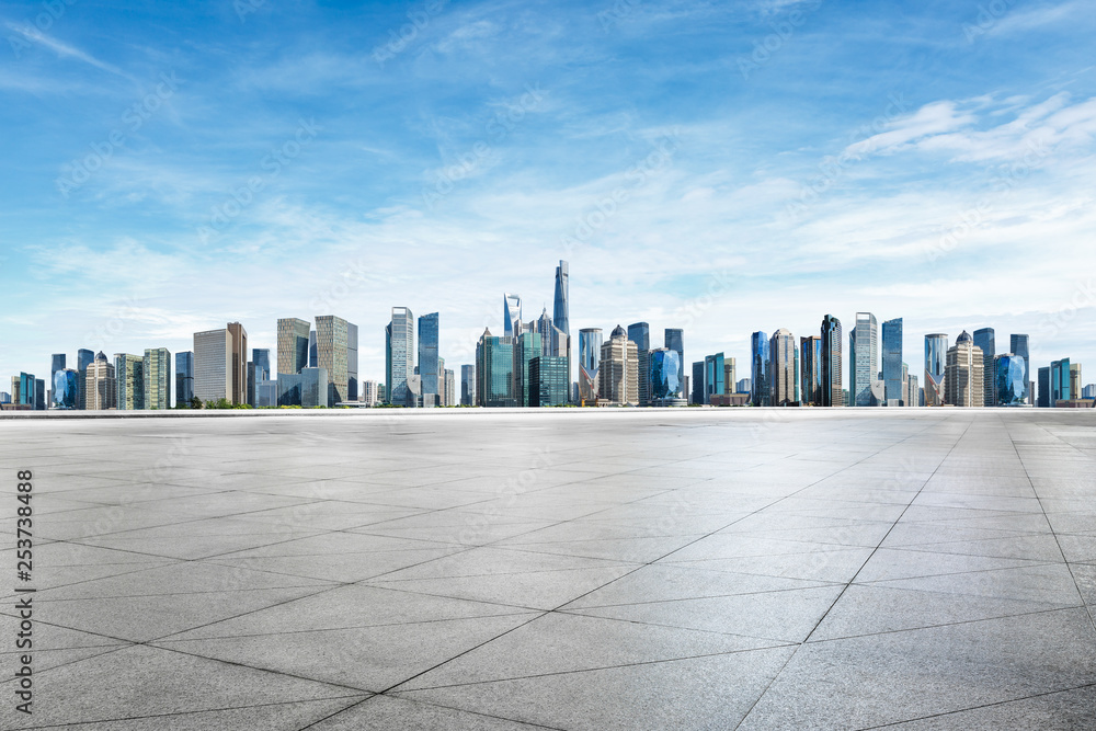 Empty square floor and panoramic city skyline with buildings in Shanghai Empty square floor and panoramic city skyline with buildings in Shanghai
