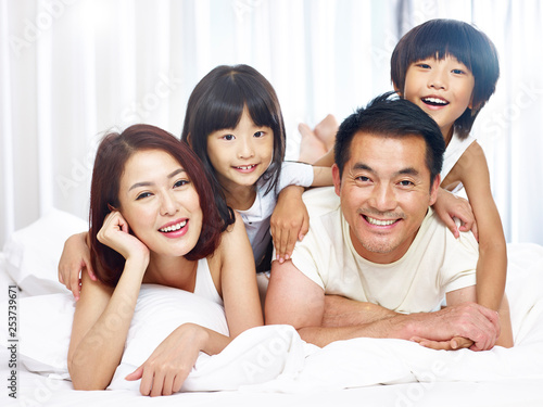 portrait of asian family with two children