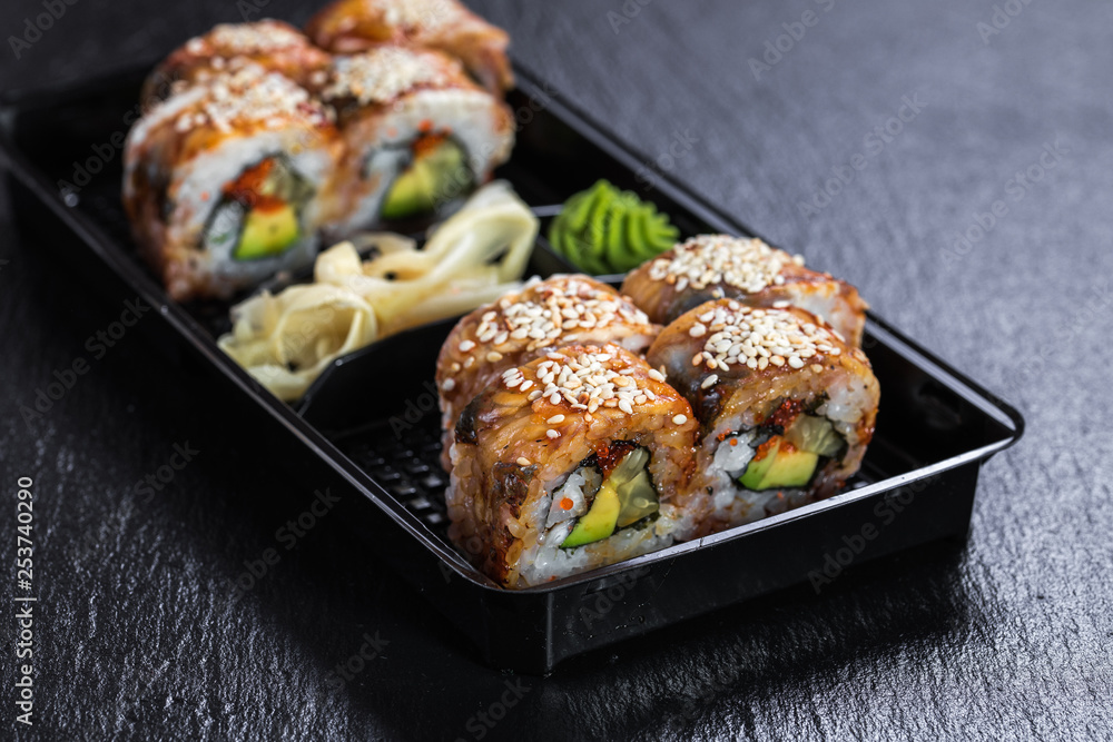 Black dragon roll with unagi in take-out container