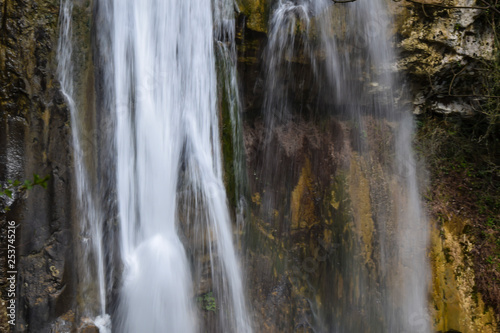 waterfall flowing in jungle wilderness landscape