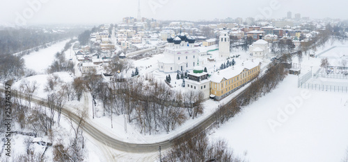 the city of Kirov and the high bank of the river Vyatka and the Alexander Grin Embankment and and Trifonov Monastery on a cloudy winter day.