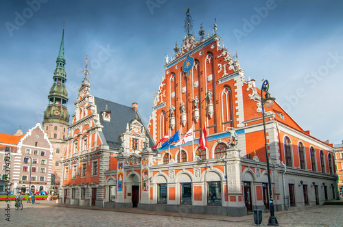 City Hall Square with House of the Blackheads and Saint Peter church in Old Town of Riga in the evening, Latvia.