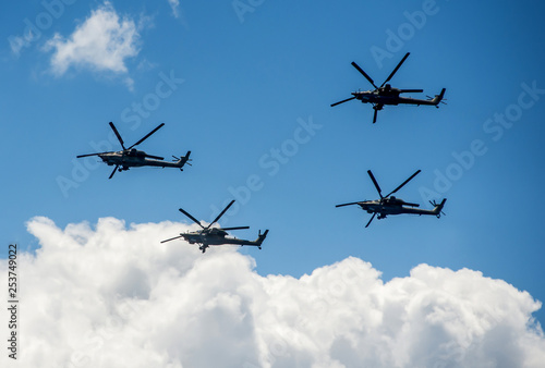 Group of military helicopters Mi-28 in the sky