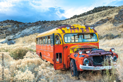 Rusty colorful old bus in Nevada ghost mining town, USA © Natalia Bratslavsky