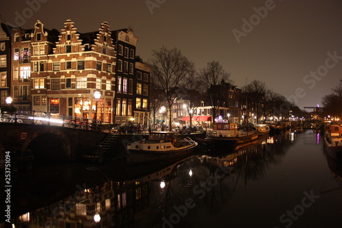 famous bridge in amsterdam. romantic night landscape. a bit of haze and fog makes the magic channel