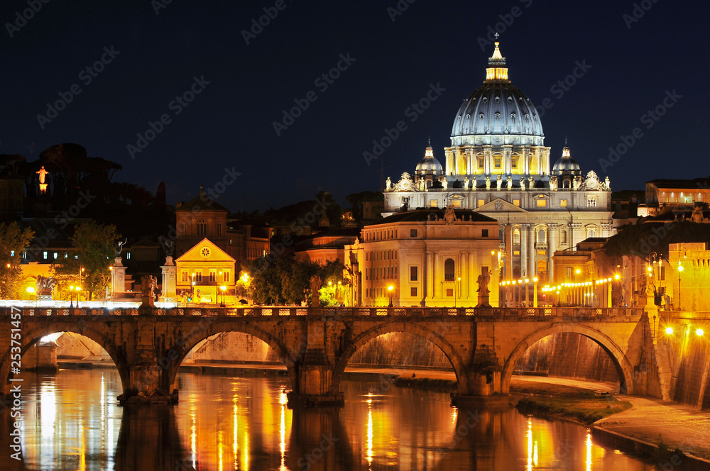 Tiber with Sant'Angelo bridge and the St. Peter's Basilica in Rome, Italy.