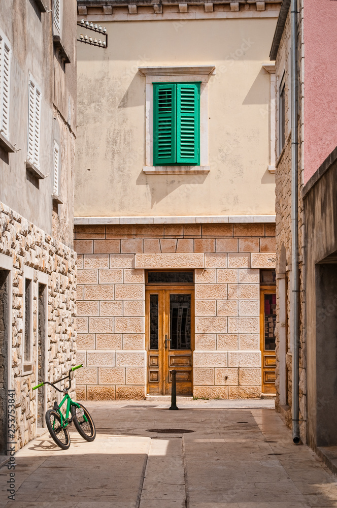 Street with green bicycle and window shutters, Vela Luka, island of Korcula, Croatia
