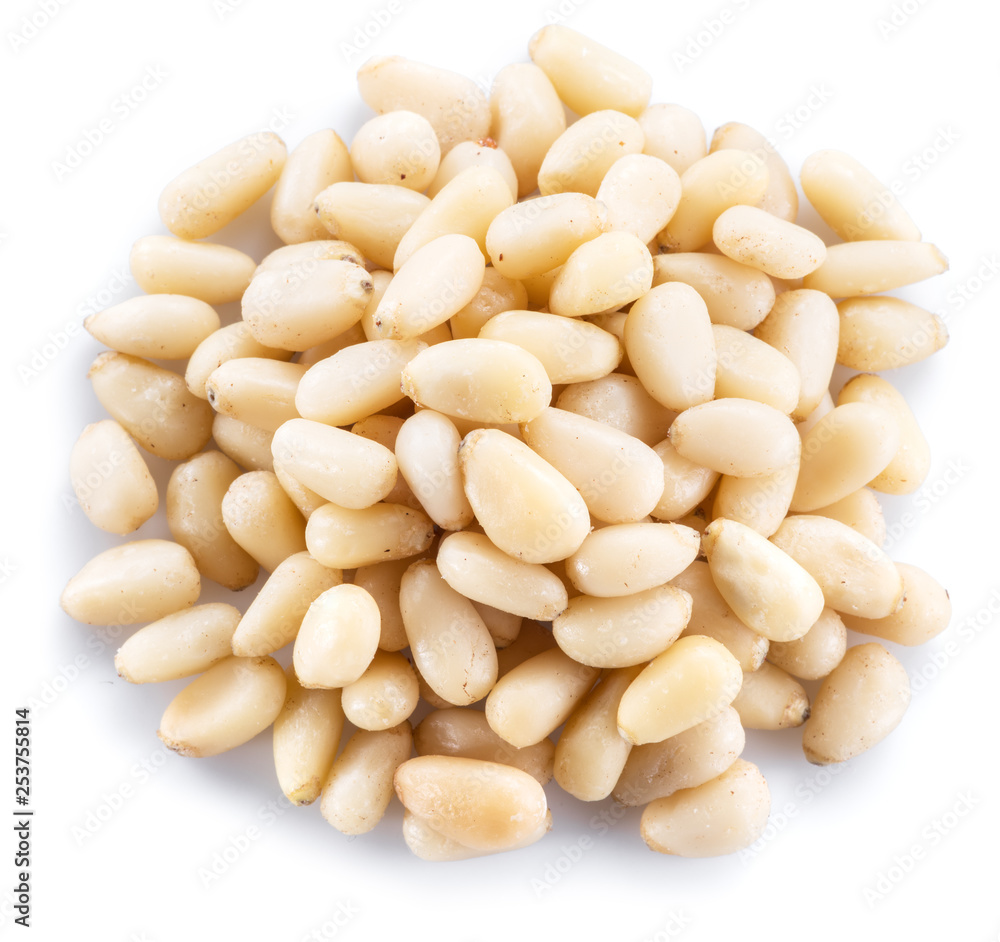 Pine nuts on the white background. Organic food. Pine nuts on the white background. Organic food.