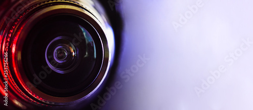 Canvas Print Camera lens and red backlight . Horizontal photography. Banner