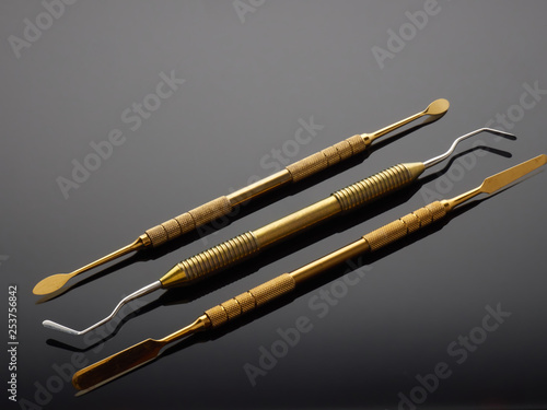 Medical dental instruments on gray gradient background