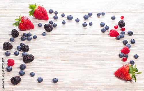 fresh berries on wooden background