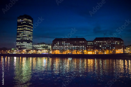 View of Millbank tower over the Thames at night, London, UK photo