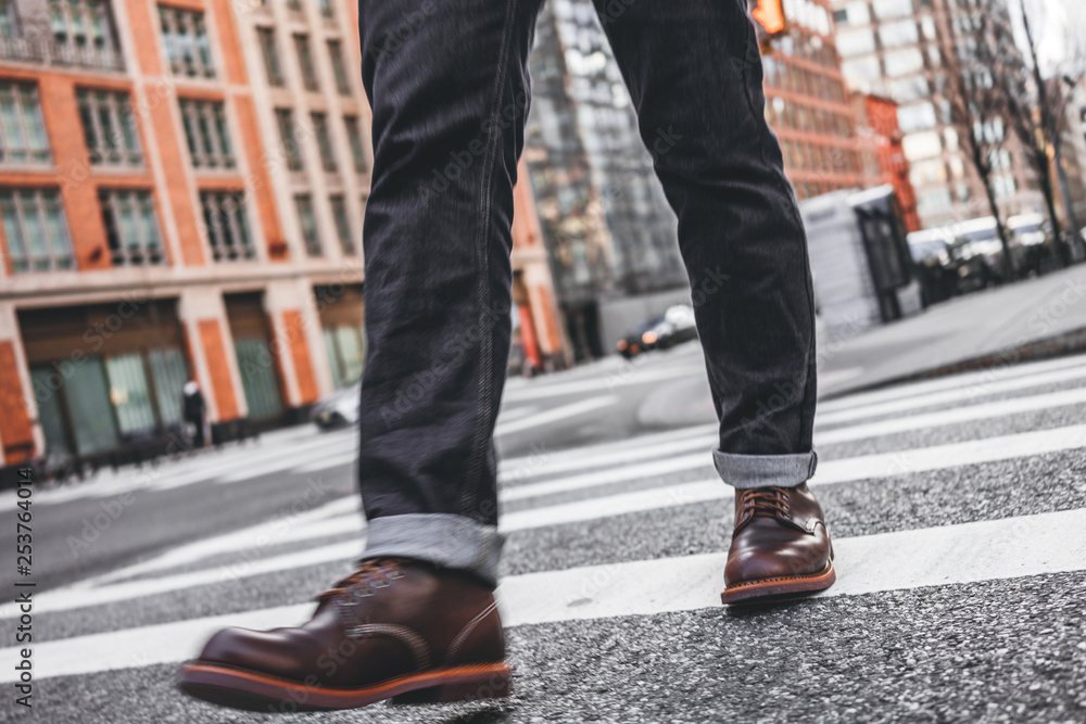 Closeup view of man legs wearing shoes crosswalk road Closeup view of man legs wearing shoes crosswalk road
