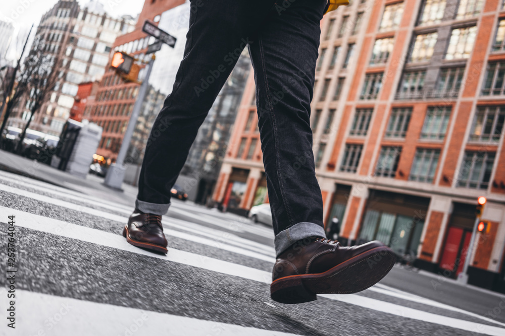 Closeup view of man legs wearing shoes crosswalk road - obrazy, fototapety, plakaty 
