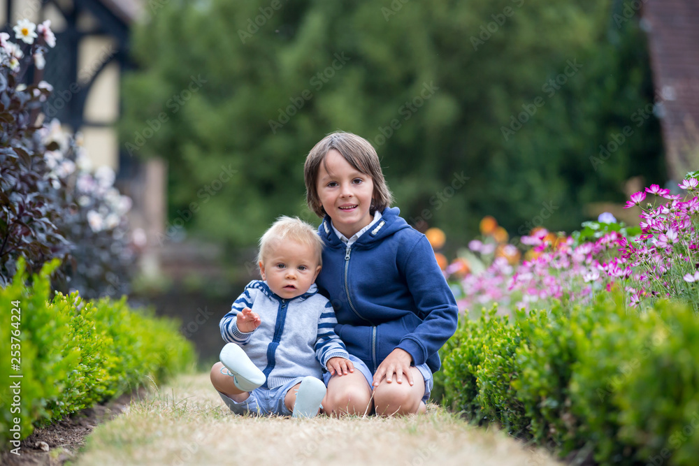 Beautiful child in amazing flower garden Beautiful child in amazing flower garden