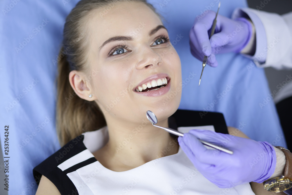 beautiful girl in the dental chair on the examination at the dentist beautiful girl in the dental chair on the examination at the dentist