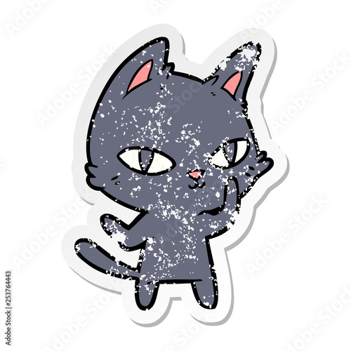 distressed sticker of a cartoon cat staring