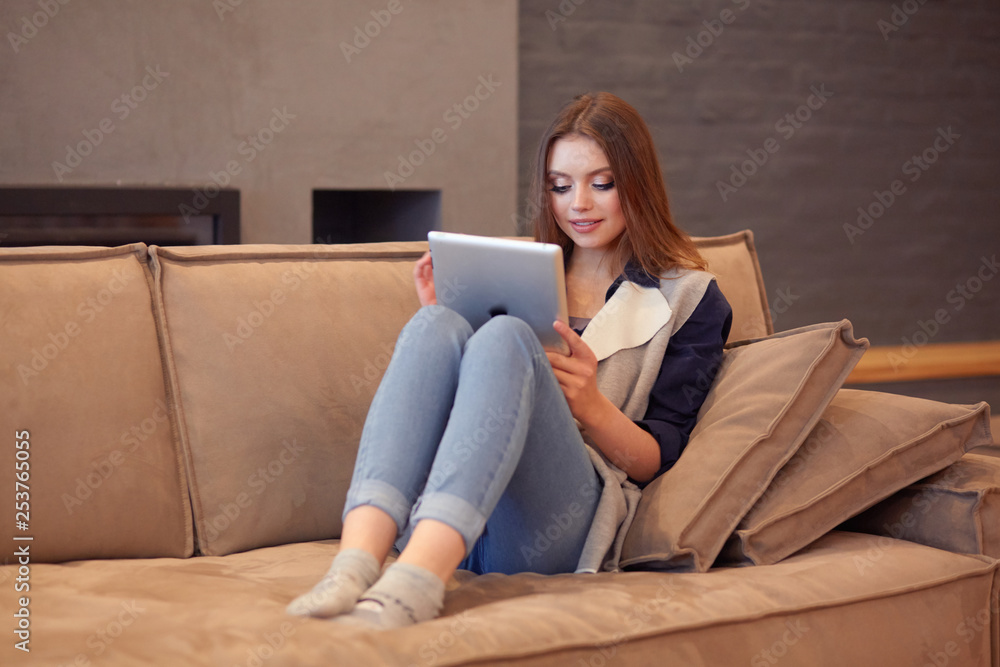 beautiful girl resting on a chic couch beautiful girl resting on a chic couch