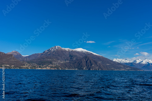 Italy, Bellagio, Lake Como with snow covered peaks background