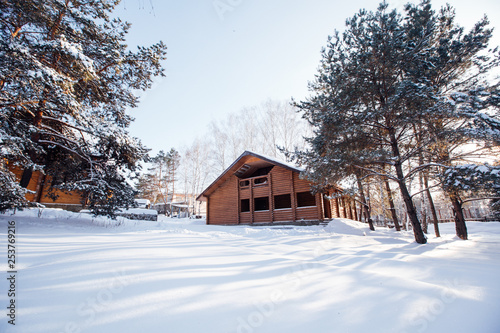 beautiful two-storey wooden house in winter © Nikita Shevchenko