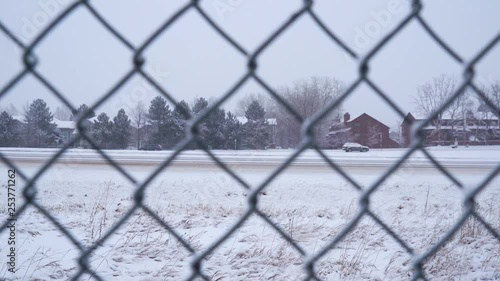 Cars driving on snow covered road photo