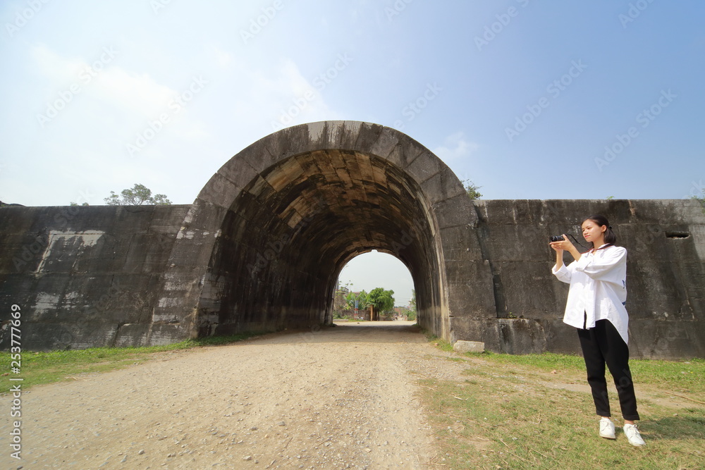 woman traveling to Ho citadel in Thanh Hoa, Vietnam