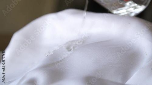 Pouring water on a moisture wicking dress shirt. photo