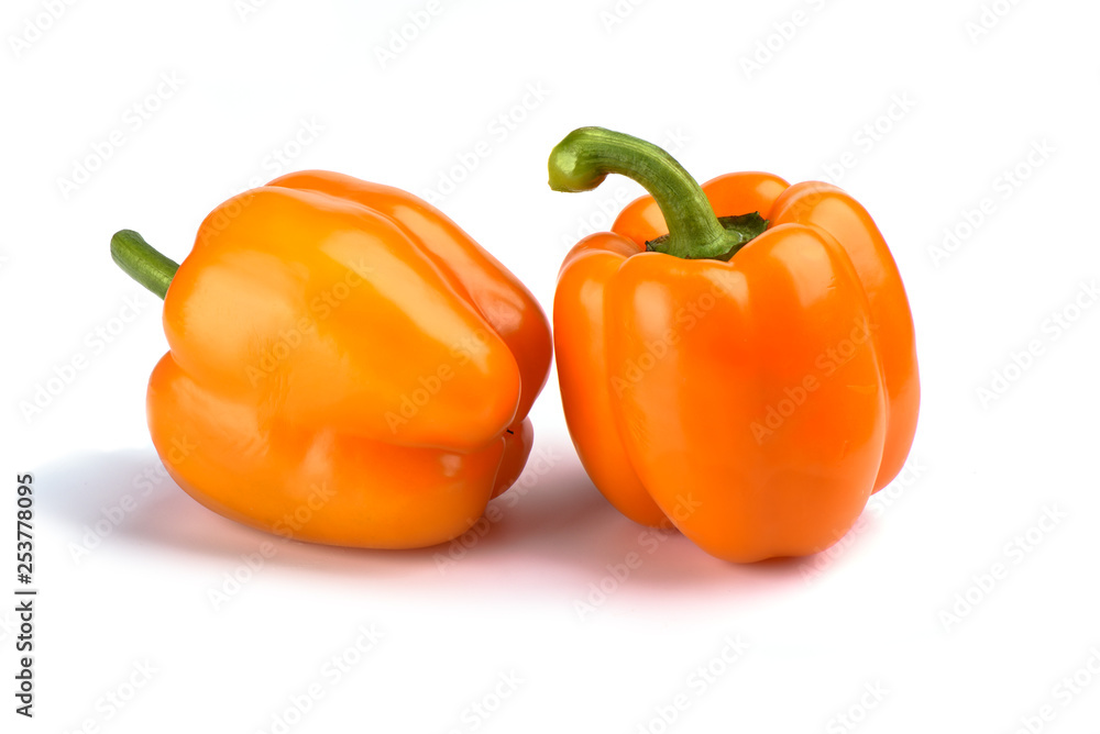 Two orange bell peppers isolated on white background Two orange bell peppers isolated on white background