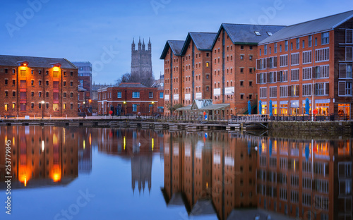 Gloucester docks and Cathedral reflected in the quay on Sharpness at twilight