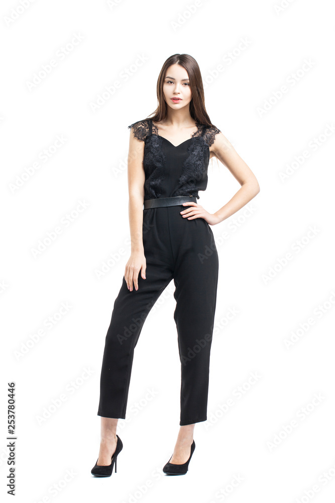 Full body, beautiful brunette woman in a black blouse and pants Full body, beautiful brunette woman in a black blouse and pants