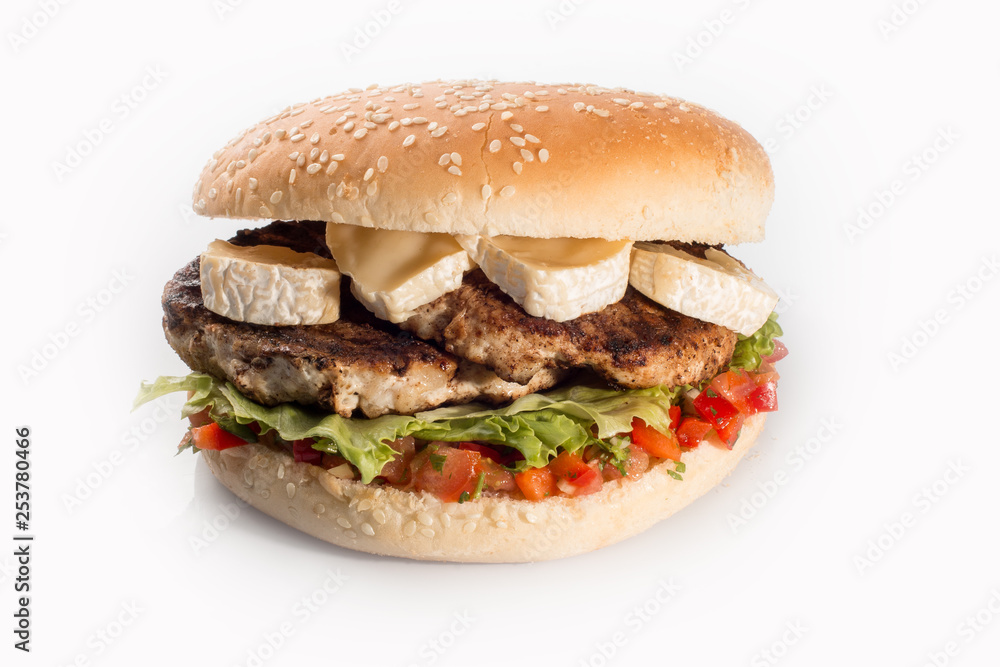 cheeseburger with beef cutlet, bacon, tomatoes and cheese slices, seasoned with sauce and green salad for a restaurant menu on a white isolated background cheeseburger with beef cutlet, bacon, tomatoes and cheese slices, seasoned with sauce and green salad for a restaurant menu on a white isolated background