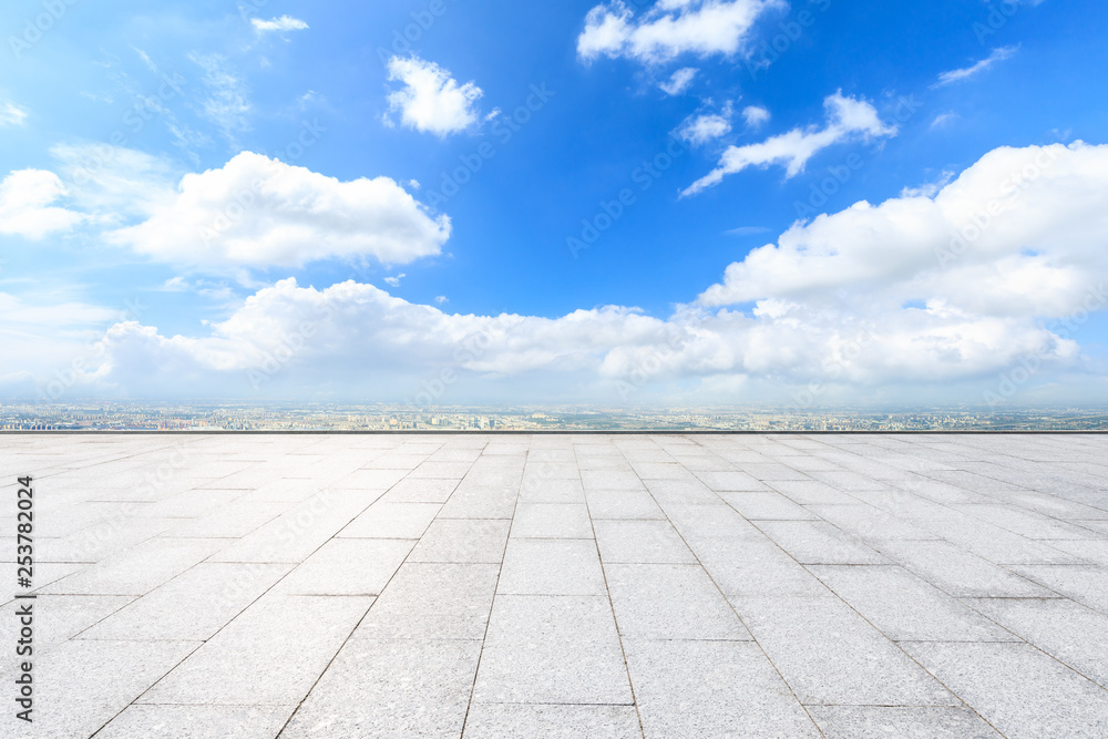 Empty square floor and modern city skyline with beautiful clouds