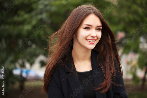 Young beautiful brunette girl in the autumn park © Andrey_Arkusha