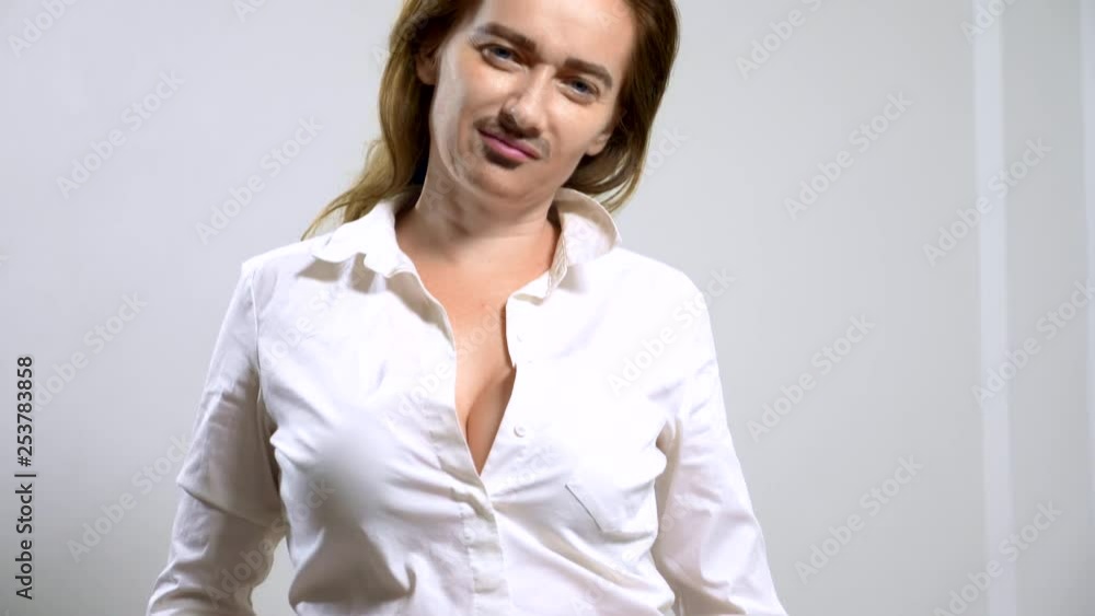 portrait of androgynous feminists with a painted mustache on her face. portrait of androgynous feminists with a painted mustache on her face.