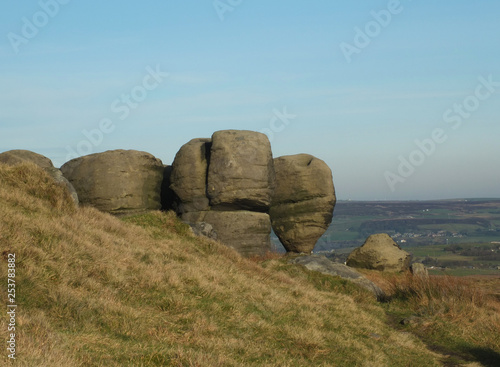 the bridestones a large group of gritstone rock formations in west yorkshire landscape near todmorden against pennine countryside © Philip J Openshaw 