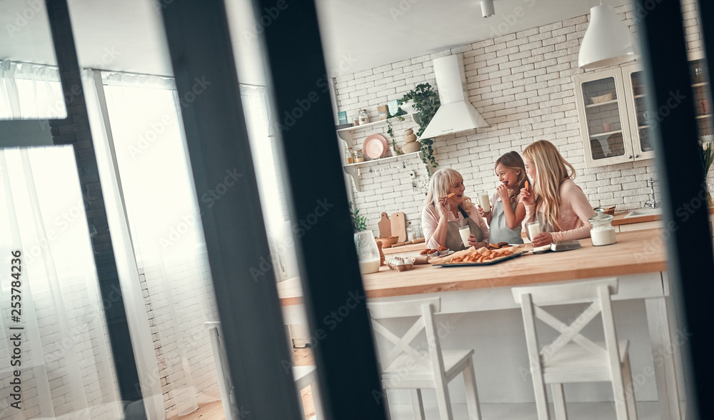 Daughter, mother and grandmother on kitchen Daughter, mother and grandmother on kitchen