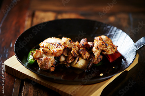 Grilled chicken on frying pan 